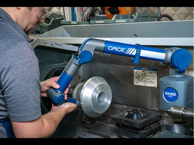 Technician calibrating a precision measuring instrument at Acro Enterprise